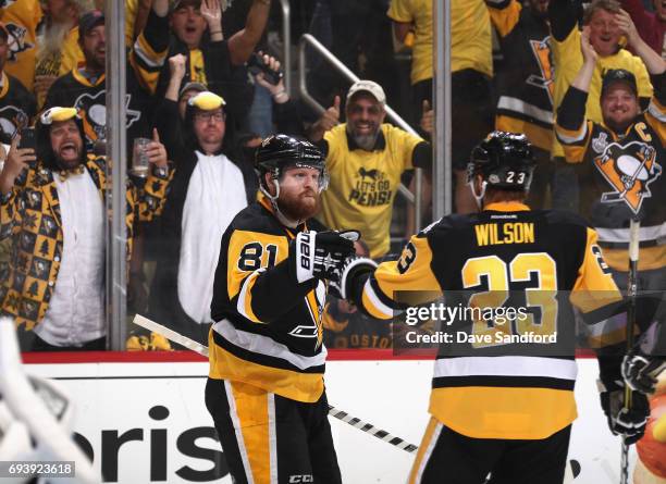 The crowd cheers as Phil Kessel of the Pittsburgh Penguins celebrates his goal with teammate Scott Wilson during the second period of Game Five of...