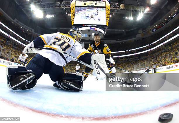 Ron Hainsey of the Pittsburgh Penguins scores his team's sixth goal against Juuse Saros of the Nashville Predators in the second period in Game Five...