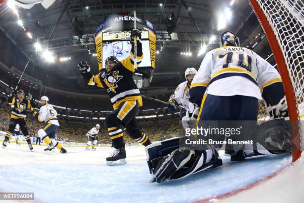 Conor Sheary of the Pittsburgh Penguins scores his team's fourth goal against Juuse Saros of the Nashville Predators in the second period in Game...