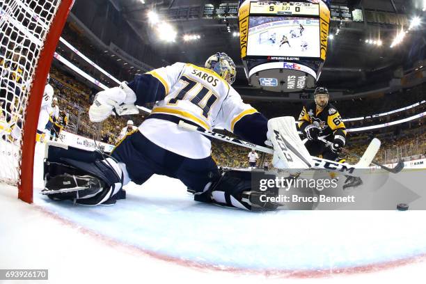 Ron Hainsey of the Pittsburgh Penguins scores his team's sixth goal against Juuse Saros of the Nashville Predators in the second period in Game Five...