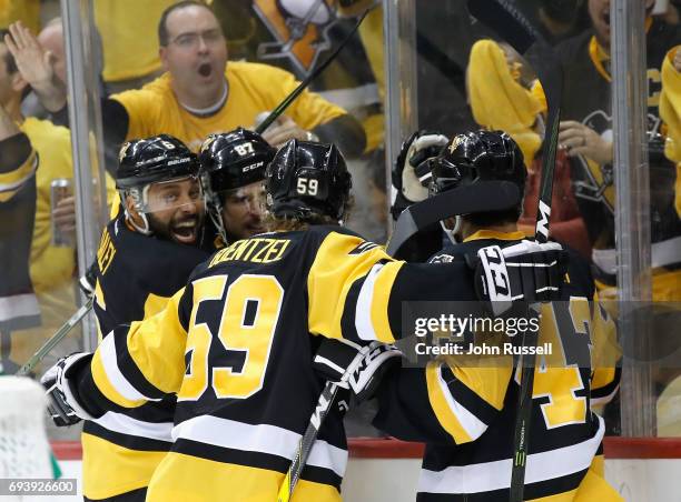 Trevor Daley, Sidney Crosby, Jake Guentzel of the Pittsburgh Penguins celebrate with teammate Conor Sheary after his goal during the second period of...