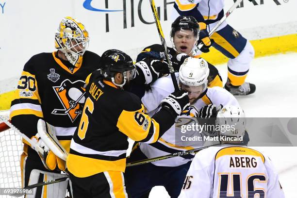 Trevor Daley of the Pittsburgh Penguins collides with Filip Forsberg of the Nashville Predators in front of goalie Matt Murray in the second period...