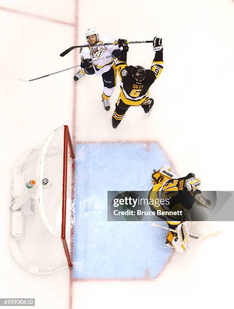 Trevor Daley of the Pittsburgh Penguins collides with Pontus Aberg of the Nashville Predators in the third period in Game Five of the 2017 NHL...