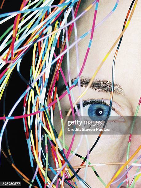 woman with head covered with multi colored wires - verheddert stock-fotos und bilder