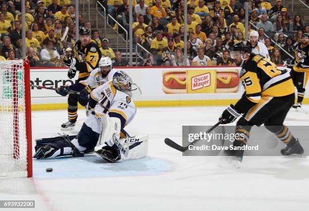 Ron Hainsey of the Pittsburgh Penguins scores a goal on goaltender Juuse Saros of the Nashville Predators during the second period of Game Five of...