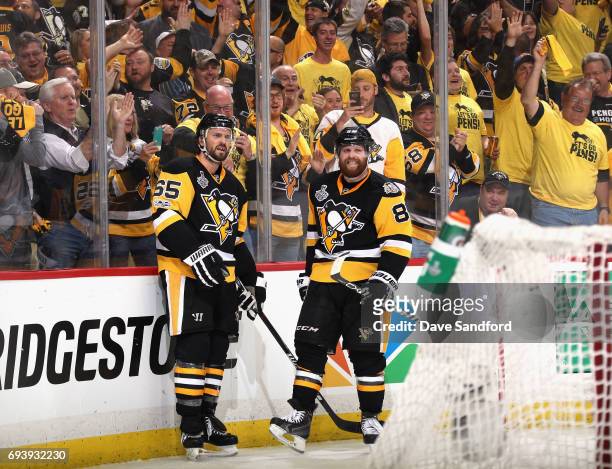 Ron Hainsey of the Pittsburgh Penguins celebrates his goal with teammate Phil Kessel during the second period of Game Five of the 2017 NHL Stanley...