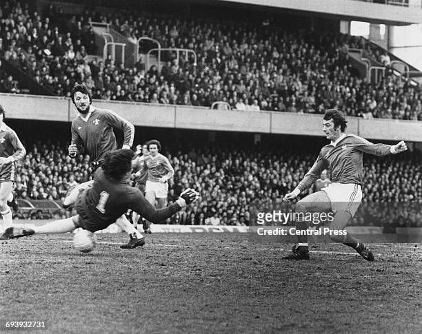 Nottingham Forest Forward Trevor Francis shoots the ball past a diving Chelsea goalkeeper Petar Borota and centre half Mickey Droy to score during...