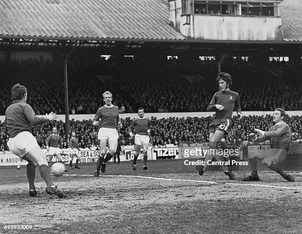 Centre Forward Ian Hutchinson of Chelsea shoots the ball past Manchester United goalkeeper Alex Stepney and centre half Ian Ure to score as...