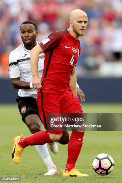 Michael Bradley of the U.S. National Team advances the ball past Khaleem Hyland of Trinidad & Tabago in the first half during the FIFA 2018 World Cup...