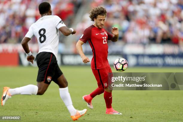 Fabian Johnson of the U.S. National Team attepts to elude Khaleem Hyland of Trinidad & Tabago in the first half during the FIFA 2018 World Cup...