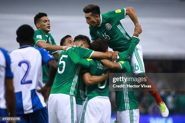 Oswaldo Alanis of Mexico celebrates with teammates after scoring the first goal of his team during the match between Mexico and Honduras as part of...