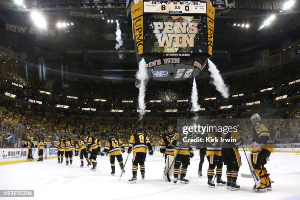 The Pittsburgh Penguins celebrate after defeating the Nashville Predators in Game Five of the 2017 NHL Stanley Cup Final at PPG PAINTS Arena on June...