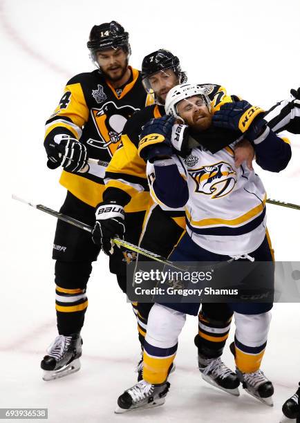 Matt Cullen of the Pittsburgh Penguins and Harry Zolnierczyk of the Nashville Predators get tangled in the third period in Game Five of the 2017 NHL...