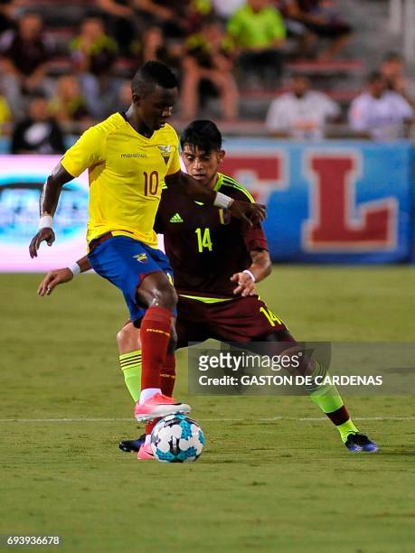 Venezuela's Junior Moreno vies for the ball against Juan Casares of Ecuador during their friendly soccer match at FAU stadium in Boca Raton, Florida...