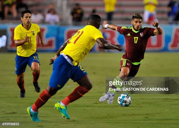 Venezuela's Jacobo Kouffati vies for the ball against Gabriel Achiller of Ecuador during their friendly soccer match at FAU stadium in Boca Raton,...
