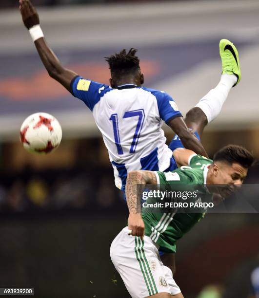 Mexicos's Carlos Salcedo vies for the ball with Honduras' midfielder Andy Najar during their World Cup 2018 CONCACAF qualifiers football match in...