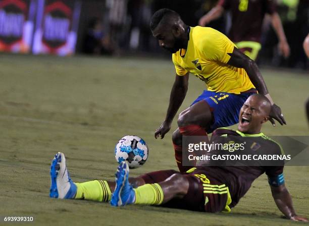 Venezuela's defender Salomon Rondon vies for the ball with Ecuador's Gabriel Achiller during their friendly soccer match at FAU stadium in Boca...