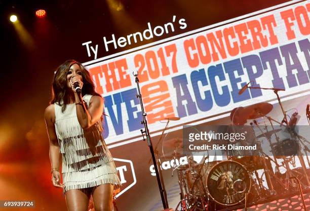 Singer-songwriter Mickey Guyton performs onstage during the 2017 Concert for Love & Acceptance on June 8, 2017 in Nashville, Tennessee.