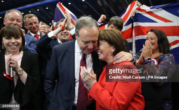 Deputy leader Nigel Dodds with his wife Diane, is elected to the North Belfast constituency at the Titanic exhibition centre in Belfast where...