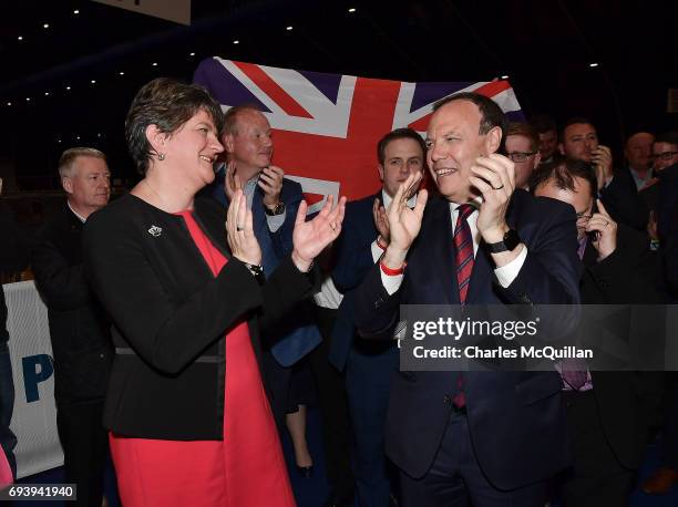 Leader Arlene Foster celebrates with DUP deputy leader Nigel Dodds at the Belfast count centre on June 9, 2017 in Belfast, Northern Ireland. After a...