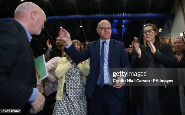 Sinn Fein's Paul Maskey is elected to the West Belfast constituency at the Titanic exhibition centre in Belfast where counting is taking place in the...