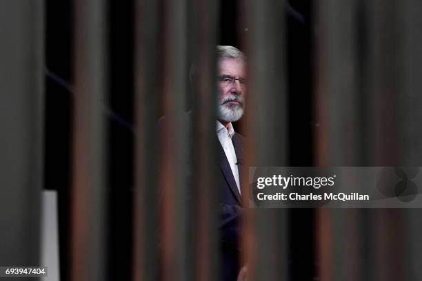 Sinn Fein president Gerry Adams waits to be interviewed by a television crew at the Belfast count taking place at the Titanic exhibition centre on...