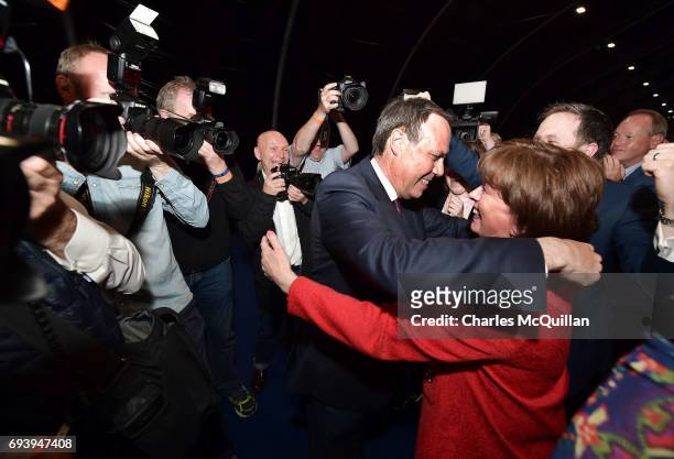 Deputy leader Nigel Dodds celebrates after being re-elected with his wife Diane Dodds at the Belfast count centre on June 9, 2017 in Belfast,...