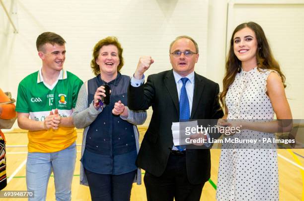 Newly elected Sinn Fein MP for West Tyrone Barry McElduff MP rises his fist in celebration with his family, son Patrick , wive Paula and daughter...