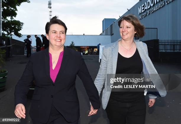 Scottish Conservative leader, Ruth Davidson leaves with her partner Jen Wilson after visiting the Meadowbank Sports Centre counting centre in...