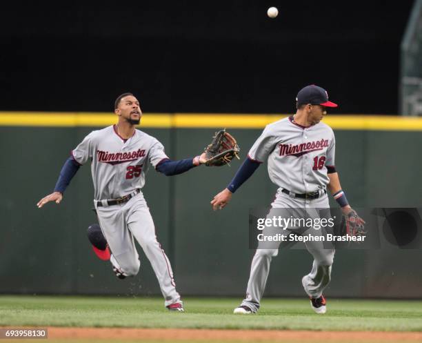 Centerfielder Byron Buxton of the Minnesota Twins catches a fly ball hit by Ben Gamel of the Seattle Mariners as shortstop Ehire Adrianza of the...