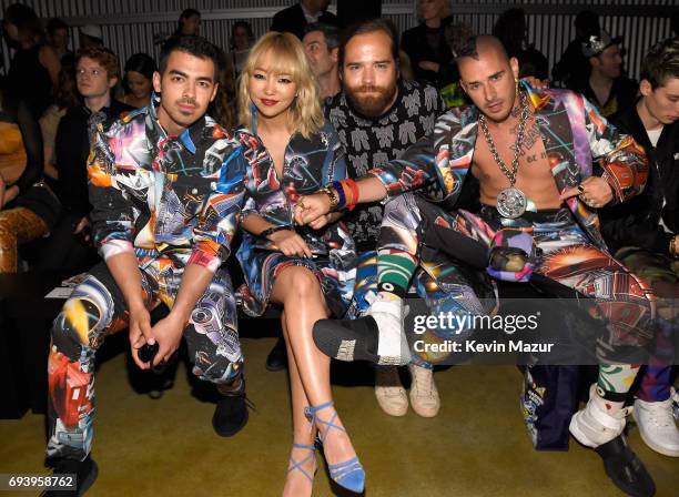 Joe Jonas, JinJoo Lee, Jack Lawless and Cole Whittle of DNCE attend Moschino Spring/Summer 18 Menswear and Women's Resort Collection at Milk Studios...