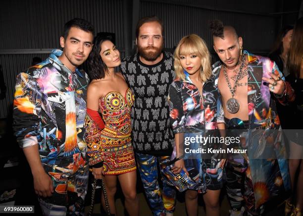 Joe Jonas of DNCE, actor Vanessa Hudgens, Jack Lawless, JinJoo Lee and Cole Whittle of DNCE attend Moschino Spring/Summer 18 Menswear and Women's...