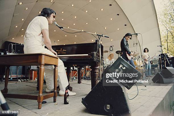 Welsh musician, composer, singer-songwriter and record producer John Cale, performing on stage at Crystal Palace Garden Party, London, 7th June 1975.