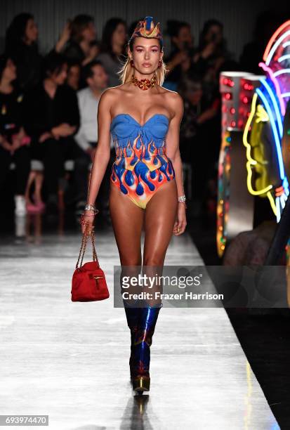 Model Hailey Baldwin walks the runway at Moschino Spring/Summer 18 Menswear and Women's Resort Collection at Milk Studios on June 8, 2017 in...