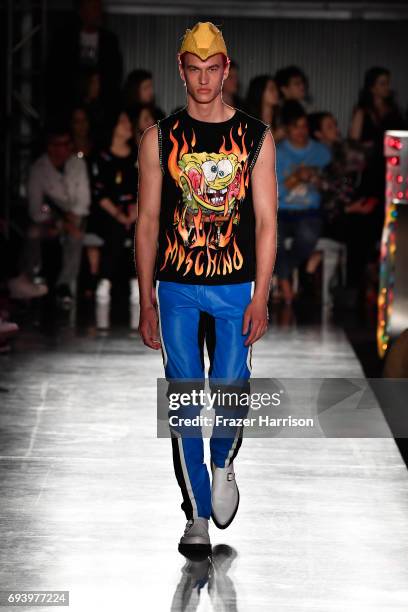 Model walks the runway at Moschino Spring/Summer 18 Menswear and Women's Resort Collection at Milk Studios on June 8, 2017 in Hollywood, California.