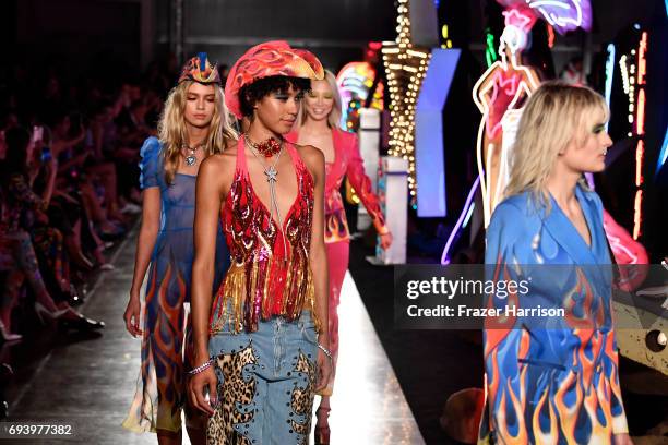 Models walk the runway at Moschino Spring/Summer 18 Menswear and Women's Resort Collection at Milk Studios on June 8, 2017 in Hollywood, California.