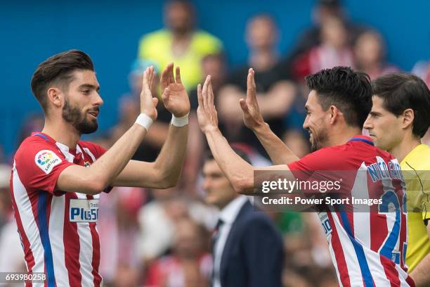 Yannick Ferreira Carrasco of Atletico de Madrid reacts with Nicolas Gaitan of Atletico de Madrid during the La Liga match between Atletico de Madrid...