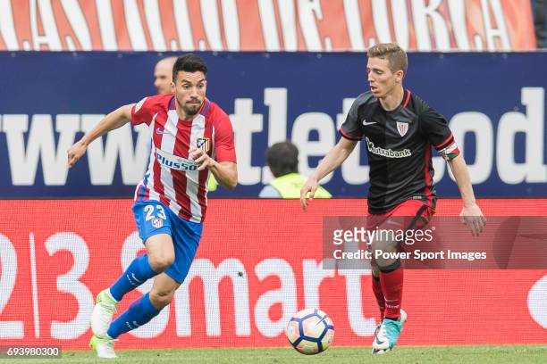 Nicolas Gaitan of Atletico de Madrid fights for the ball with Iker Muniain Goni of Athletic Club during the La Liga match between Atletico de Madrid...