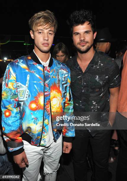 Cameron Dallas and actor Taylor Lautner attend the Moschino Afterparty at Hollywood Roosevelt Hotel on June 8, 2017 in Hollywood, California.