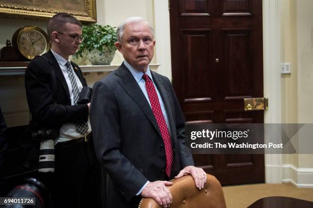 Attorney General Jeff Sessions stands waiting during a meeting with the Fraternal Order of Police in the Roosevelt Room of the White House in...