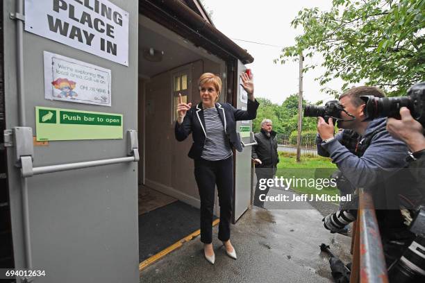 Leader Nicola Sturgeon exits after casting her vote in the general election at Broomhouse Community Hall on June 8, 2017 in Glasgow,...