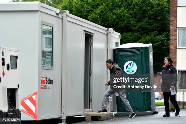 Voters enter a mobile polling station in Stalybridge on June 8, 2017 in Greater Manchester, United Kingdom. Voters are going to the polls today to...