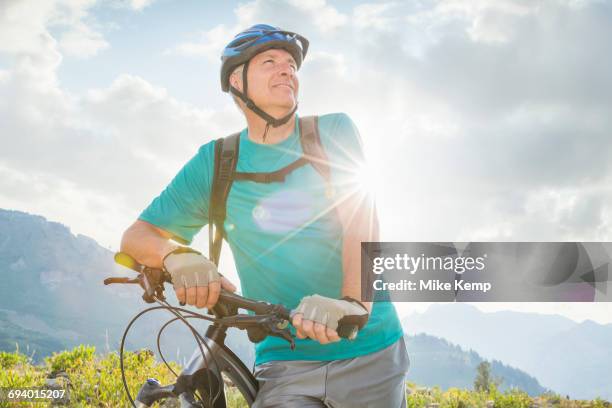caucasian man standing with mountain bike - one mature man only photos stock pictures, royalty-free photos & images