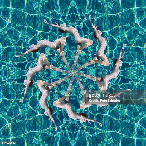 multiple exposure of caucasian woman swimming in spiral - synchronized swimming photos et images de collection