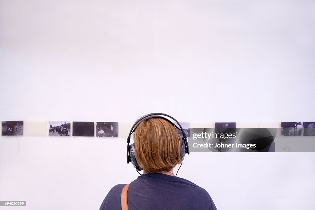 Young woman looking at exhibition