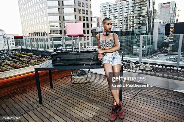 black dj relaxing on urban rooftop - dj table stock pictures, royalty-free photos & images