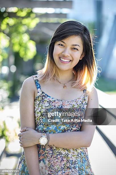 portrait of smiling chinese woman wearing dress -  "suprijono suharjoto" or "take a pix media" stock pictures, royalty-free photos & images