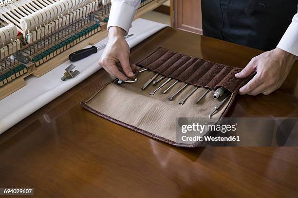 piano tuner tuning grand piano - tuning stock pictures, royalty-free photos & images