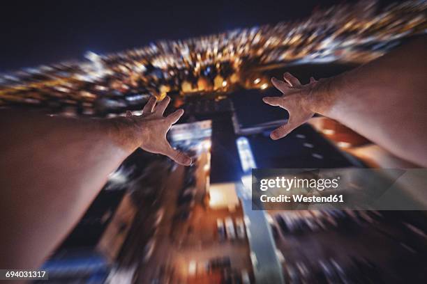 man jumping from building into death, partial view - arm reaching down stock pictures, royalty-free photos & images