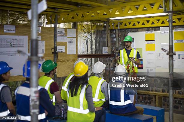 construction engineers getting a safety briefing - construction safety stock pictures, royalty-free photos & images